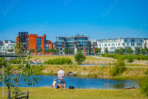 A couple is resting and looking at the view of the western harbor in Malmö photo