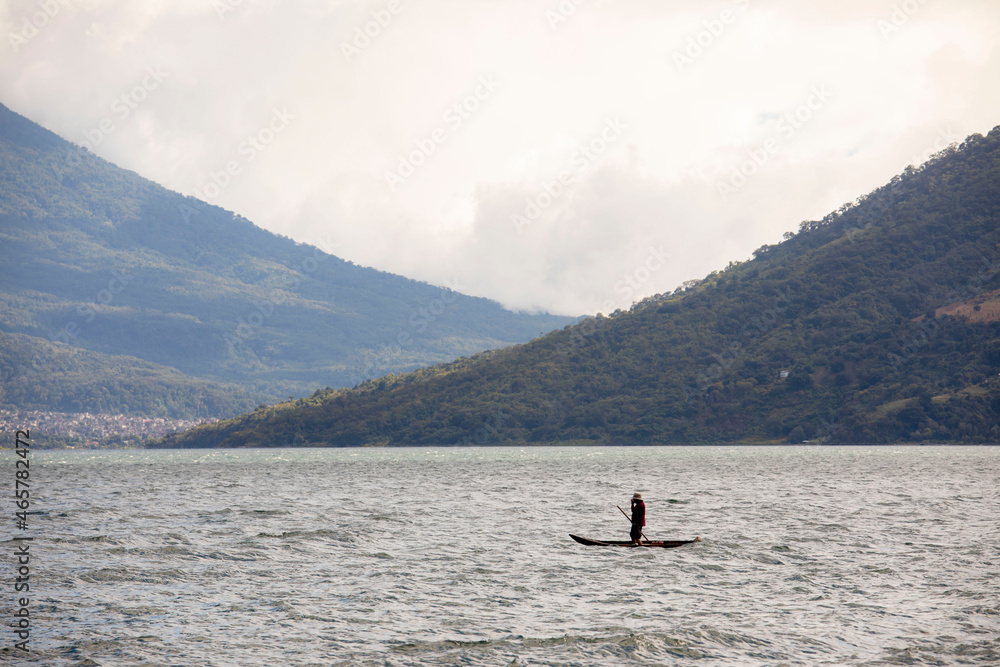 Fototapeta premium fisherman on boat in Guatemala 
