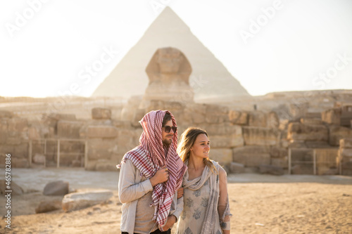 traveling couple at the pyramids of Giza

