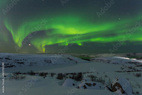 At night in winter  the tundra and the aurora borealis.