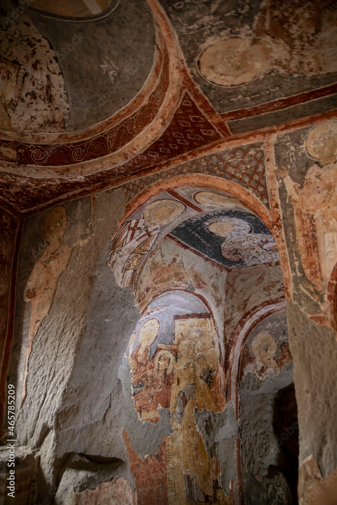 interior of ancient paintings in rock church in turkey