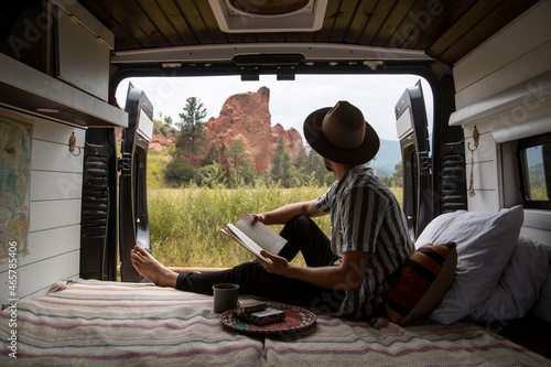 man living in his van in Colorado mountains © Zach