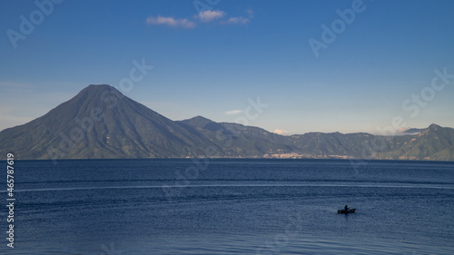 Panoramic view of a local fisherman on Lake Atitlan in Panajachel, Guatemala at sunrise