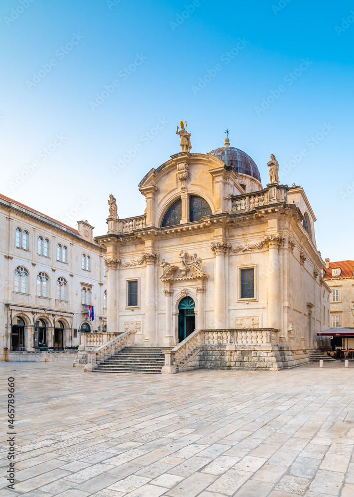 Square at St Blaise Church and people at Stradun Street in the Old city of Dubrovnik, Croatia. Summer morning with soft light.
