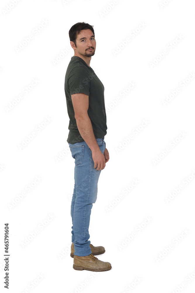 full portrait of a man in profile looking at camera on white background full portrait of a man in profile looking at camera on white background