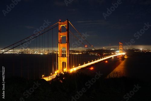 Fototapeta Naklejka Na Ścianę i Meble -  Golden Gate Bridge is illuminated during night