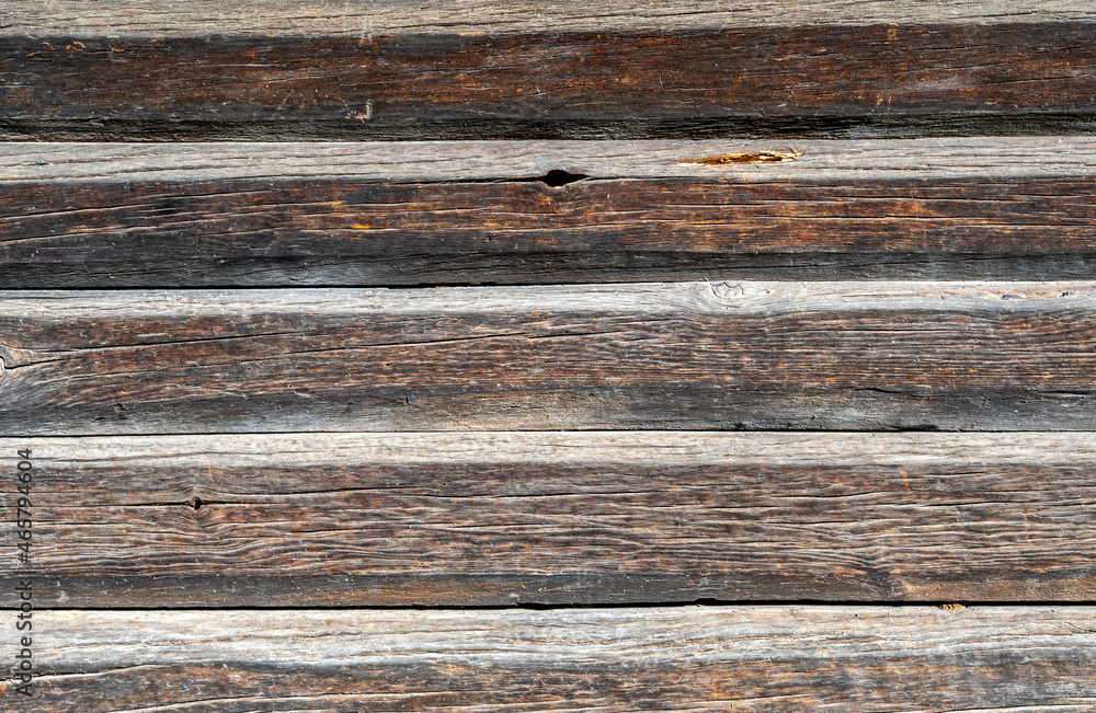 Background from old wooden boards with an interesting texture. Textured wood pattern. Photos of boards fitted to each other. Background from old wooden boards with an interesting texture. Textured wood pattern. Photos of boards fitted to each other.