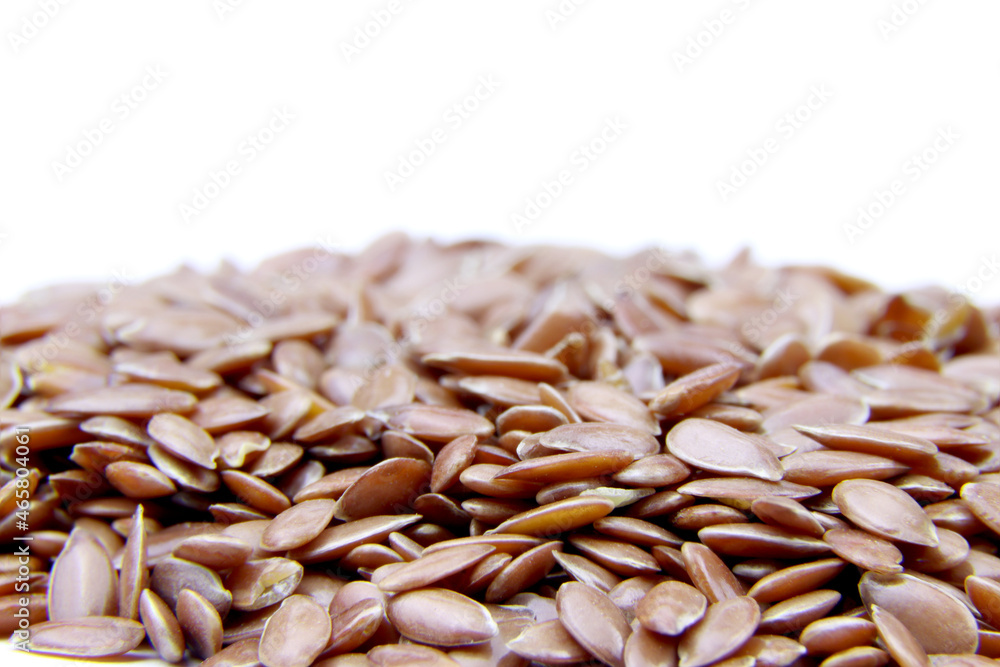 Flax seeds isolated on a white background. Seeds of flax. Super food. Vegetarian healthy food. Macro view.