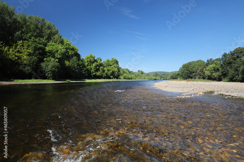 Beautiful panoramic view over the French river la Dordogne. Photo was taken on a sunny day with a blue sky.