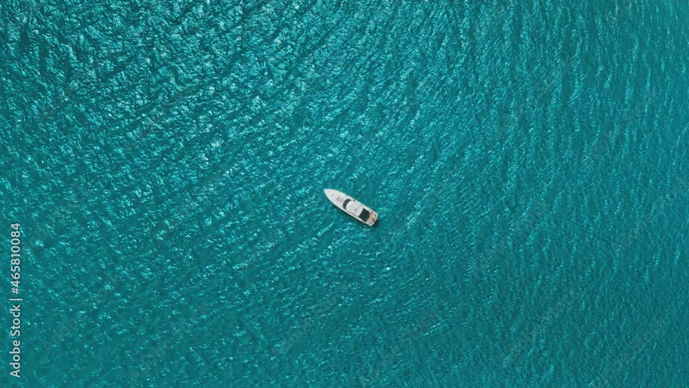 Holiday sea travel background. White luxury yacht motor boat aerial top down view, sailing on turquoise sea water waves. Nature marine landscape. Exotic summer vacation, holiday, tourism, travel Holiday sea travel background. White luxury yacht motor boat aerial top down view, sailing on turquoise sea water waves. Nature marine landscape. Exotic summer vacation, holiday, tourism, travel