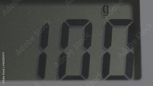 electronic scales display showing one hundred grams
