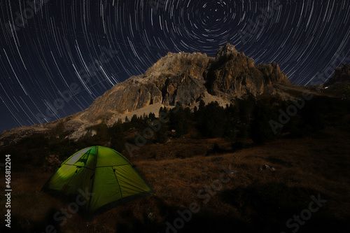Dolomites startrails with tent