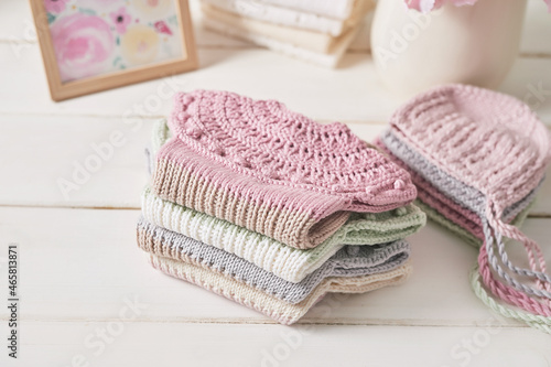 Knitted kids clothes and accessories for knitting. Needlework and knitting. Hobbies and creativity. Knit for children. Handmade