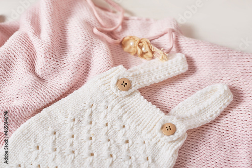 Knitted kids clothes and accessories for knitting. Needlework and knitting. Hobbies and creativity. Knit for children. Handmade