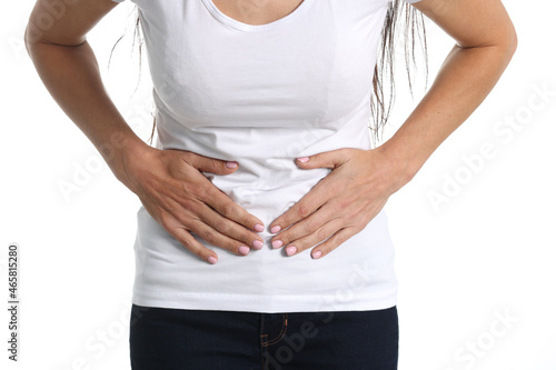 Young woman holding on to sore belly closeup photo