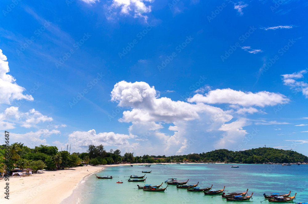 Beautiful Andaman sea, Tropical Turquoise clear blue sea and white sand beach on pattaya beach with blue sky background at Lipe Island, Satun, Thailand -  summer vacation travel