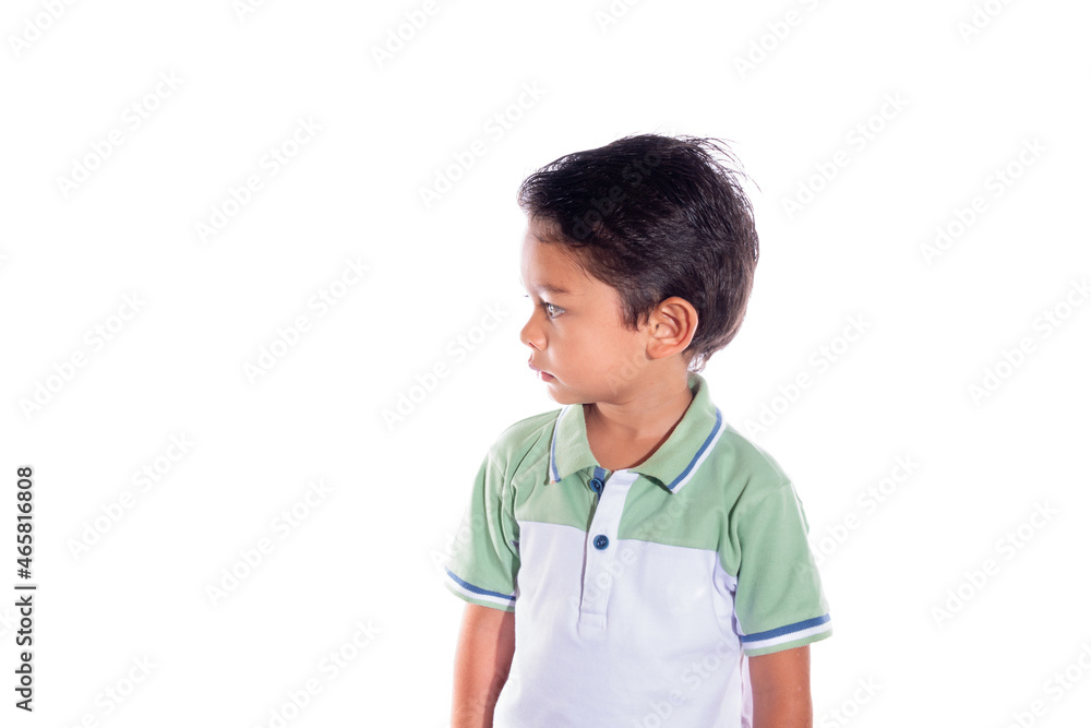 Beautiful little boy looking left, isolated on white background. Latin child with serious expression. Beautiful little boy looking left, isolated on white background. Latin child with serious expression.