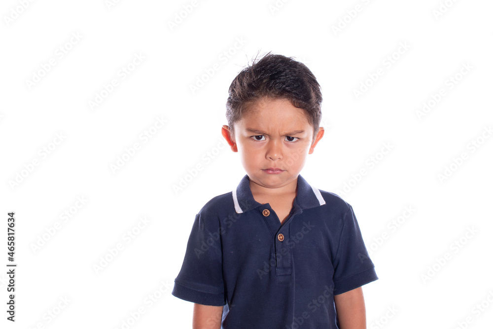 Beautiful angry boy looking at camera, isolated on white background. Very angry latin boy. Beautiful angry boy looking at camera, isolated on white background. Very angry latin boy.