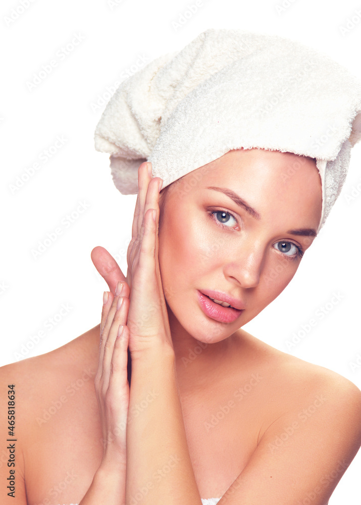 Portrait of beautiful girl touching her face with a towel on head Portrait of beautiful girl touching her face with a towel on head