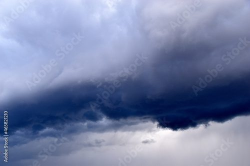 Blue and white cumulus storm clouds thunderstorm landscape