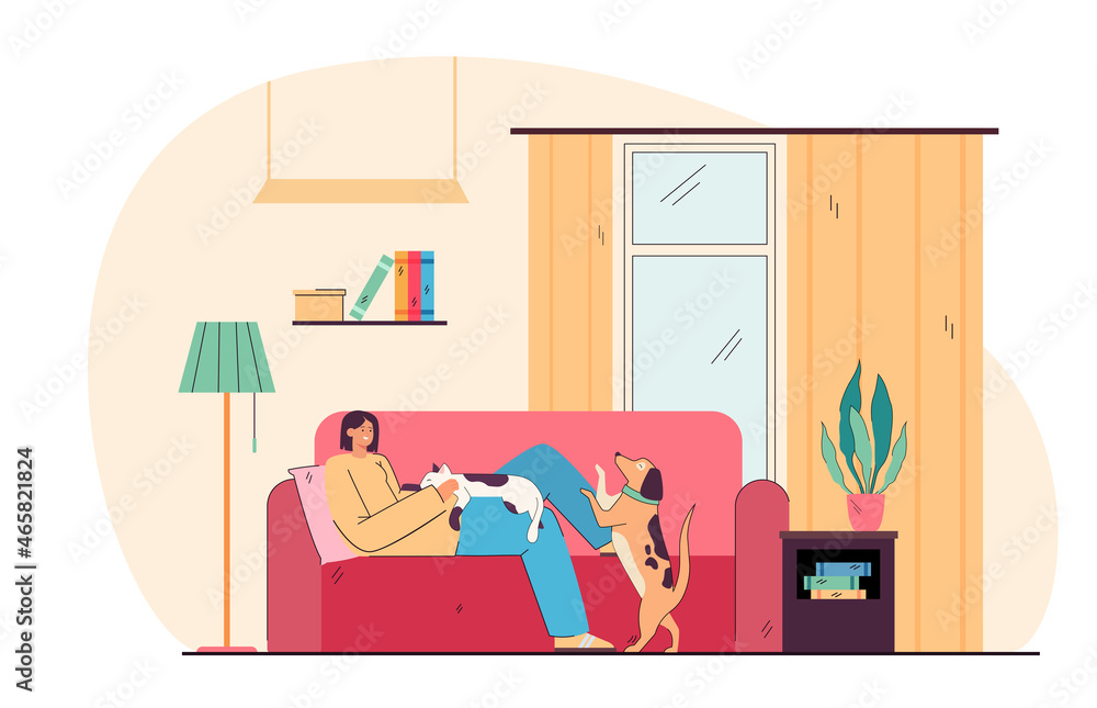 Obraz premium Adorable smiling young girl lying on cozy sofa with dog and cat. Portrait of happy pet owner on couch at home flat cartoon vector illustration. Relax, hygge, love of animal concept