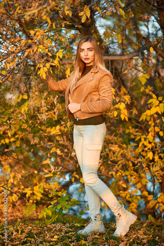 Outdoor portrait of beautiful blonde woman in jacket
