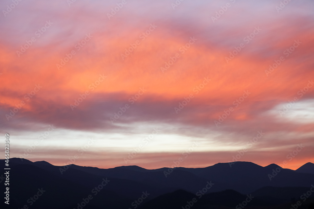 Picturesque view of beautiful cloudy sky over mountains