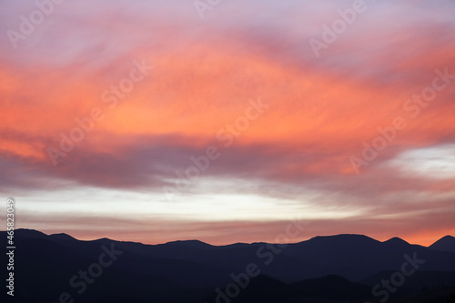 Picturesque view of beautiful cloudy sky over mountains