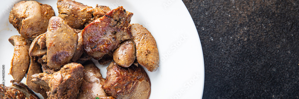 chicken liver fried or stewed fresh offal portion ready to eat meal snack on the table copy space food background rustic. top view keto or paleo diet chicken liver fried or stewed fresh offal portion ready to eat meal snack on the table copy space food background rustic. top view keto or paleo diet