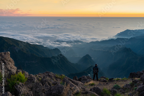 Sunrise in the mountains with plenty of clouds, fog - Pico do Arieiro (Parque de Estacionamento, Madeira, Portugal). 