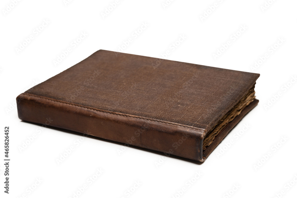 An old brown book isolated on white background. An old brown book isolated on white background.