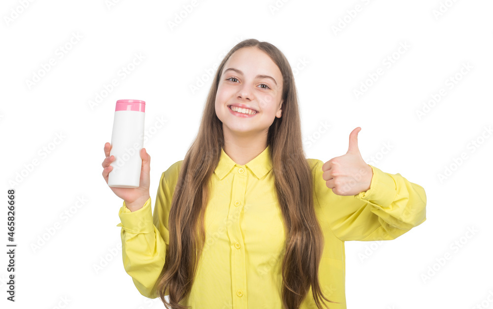 happy teen girl presenting hair body conditioner isolated on white show thumb up, personal care. happy teen girl presenting hair body conditioner isolated on white show thumb up, personal care.