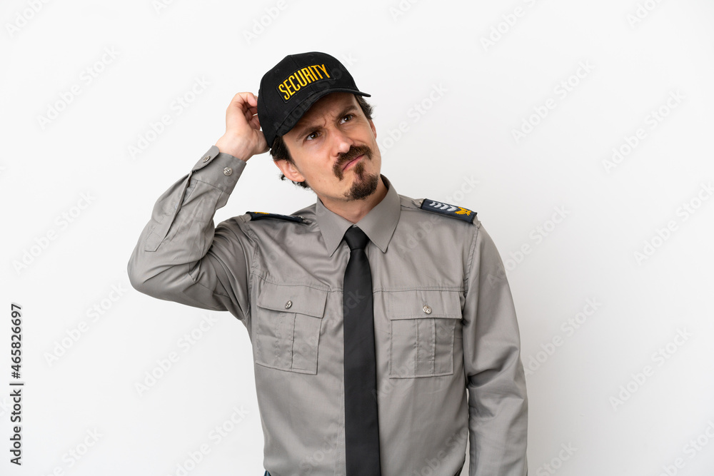 Young caucasian security man isolated on white background having doubts and with confuse face expression Young caucasian security man isolated on white background having doubts and with confuse face expression