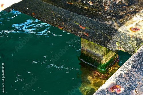 Canvas Print Abandoned pier. Corrosion of reinforced concrete.