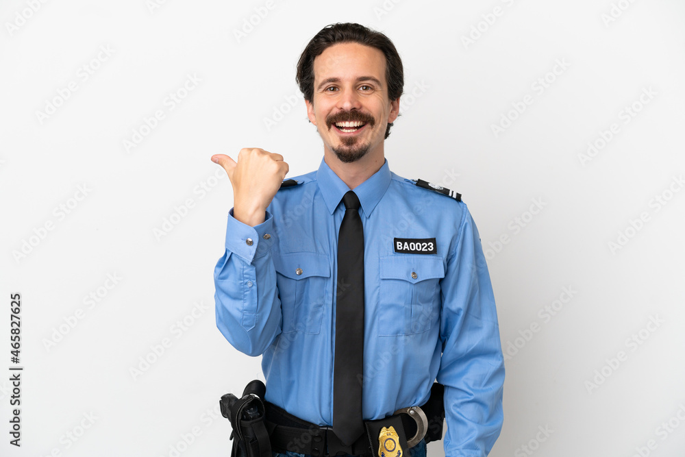 Young police man over isolated background white pointing to the side to present a product Young police man over isolated background white pointing to the side to present a product