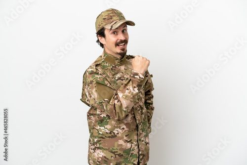 Soldier man isolated on white background celebrating a victory