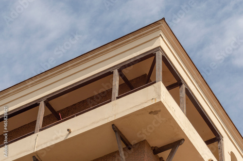 upper terrace of a building with wooden structures