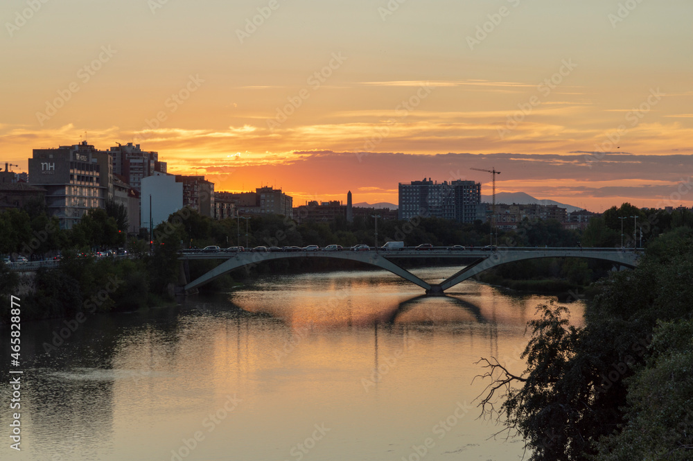 view of the sunset from the bridge over the ebro river