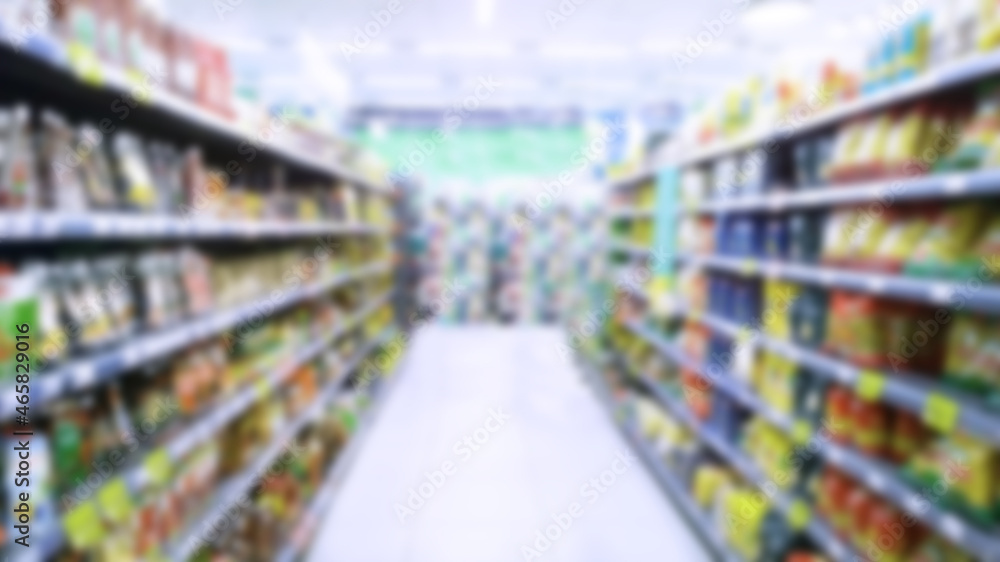 Abstract blur image of supermarket background. Defocused shelves with food and products. Grocery shopping. Store. Retail industry. Rack. Discount. Inflation and crisis concept. Supply Chain Issues.