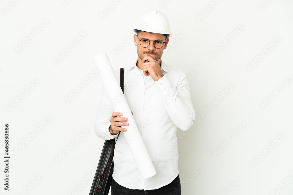 Young architect man with helmet and holding blueprints isolated on white background thinking Young architect man with helmet and holding blueprints isolated on white background thinking