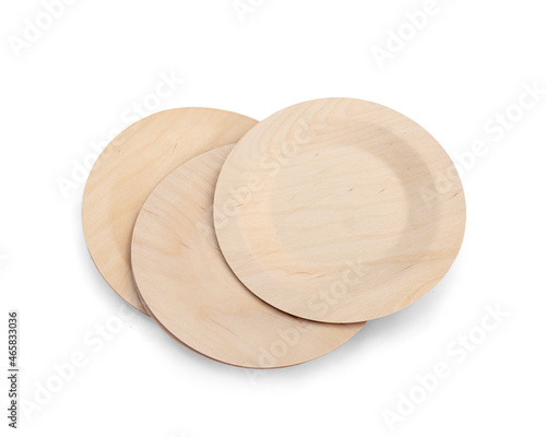 Eco-friendly wooden disposable cutlery. Round plates on white background