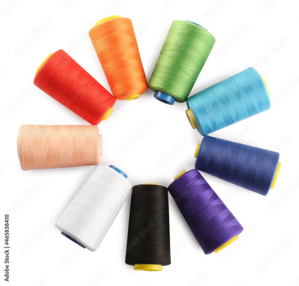 Frame of colorful sewing threads on white background, top view. Space for text Frame of colorful sewing threads on white background, top view. Space for text