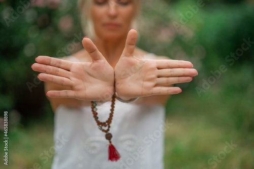 Yogic hand gesture, Kundalini Yoga, hand charger, Close-up of the hands of a man who meditate inside, focus on hands in the gesture, Yogic hand gesture,Reiki
