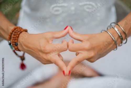 Yogic hand gesture, Kundalini Yoga, Close-up of the hands of a man who meditate inside, focus on hands in the gesture, Yogic hand gesture, Kundalini Yoga Reiki