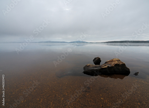 Foggy morning on the lake Lipno in the mountains Sumava, Czech Republic