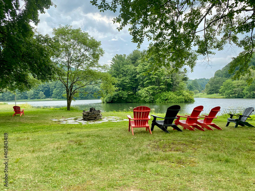 Black and red adirondack chairs near Abbott Lake in the Peaks of Otter area of the Blue Ridge Parkway in Virginia. Relax and enjoy the views. photo