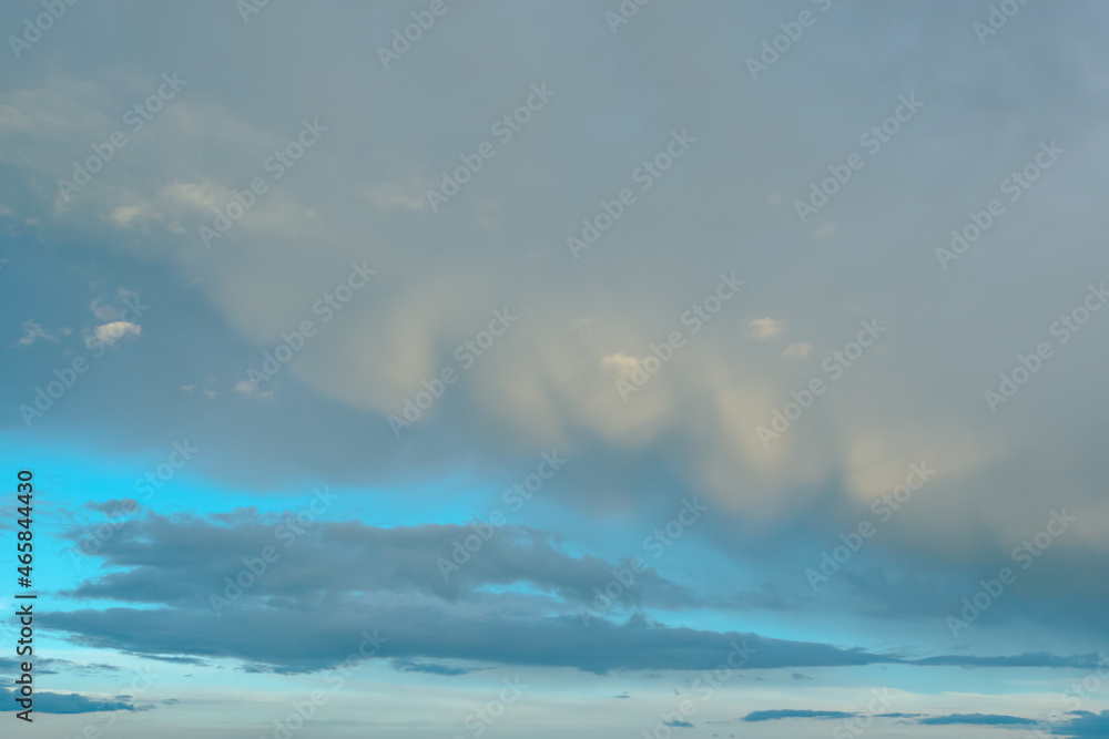 cumulus storm clouds in the sky above the ground in cloudy weather