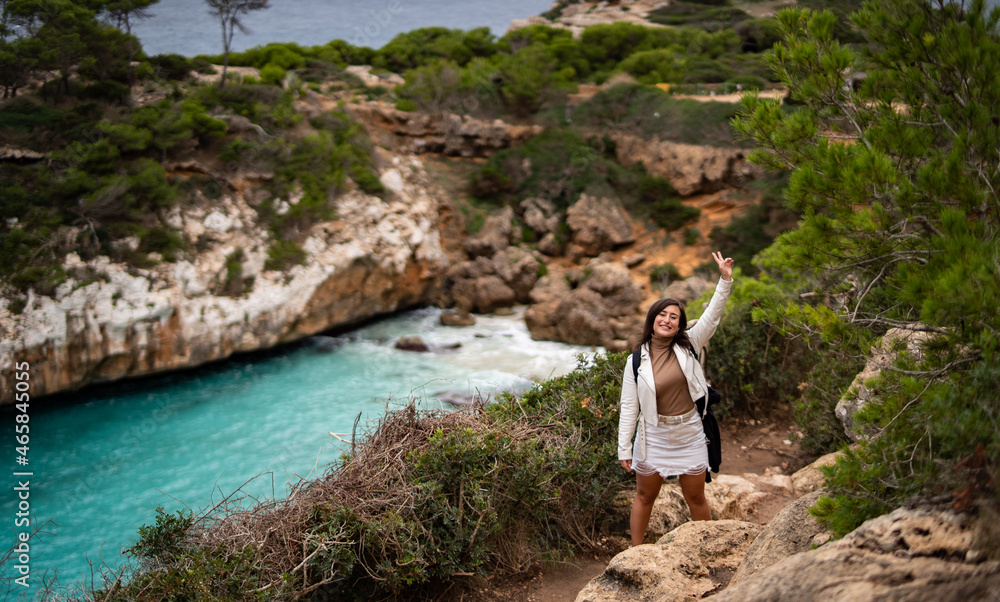 Naklejka premium girl exploring and enjoining hiking on mountains in Spain