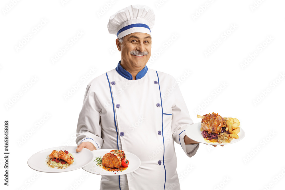 Cheerful chef smiling and holding three plates with different food Cheerful chef smiling and holding three plates with different food