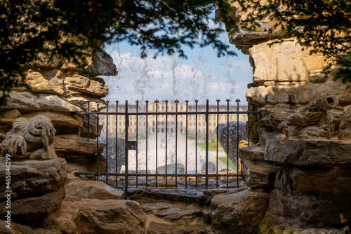 Stone walls and the gate at Schonbrunner Schloss Park under the sunlight in Vienna, Austria photo